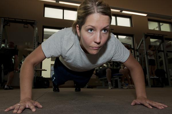 female in push up plank position